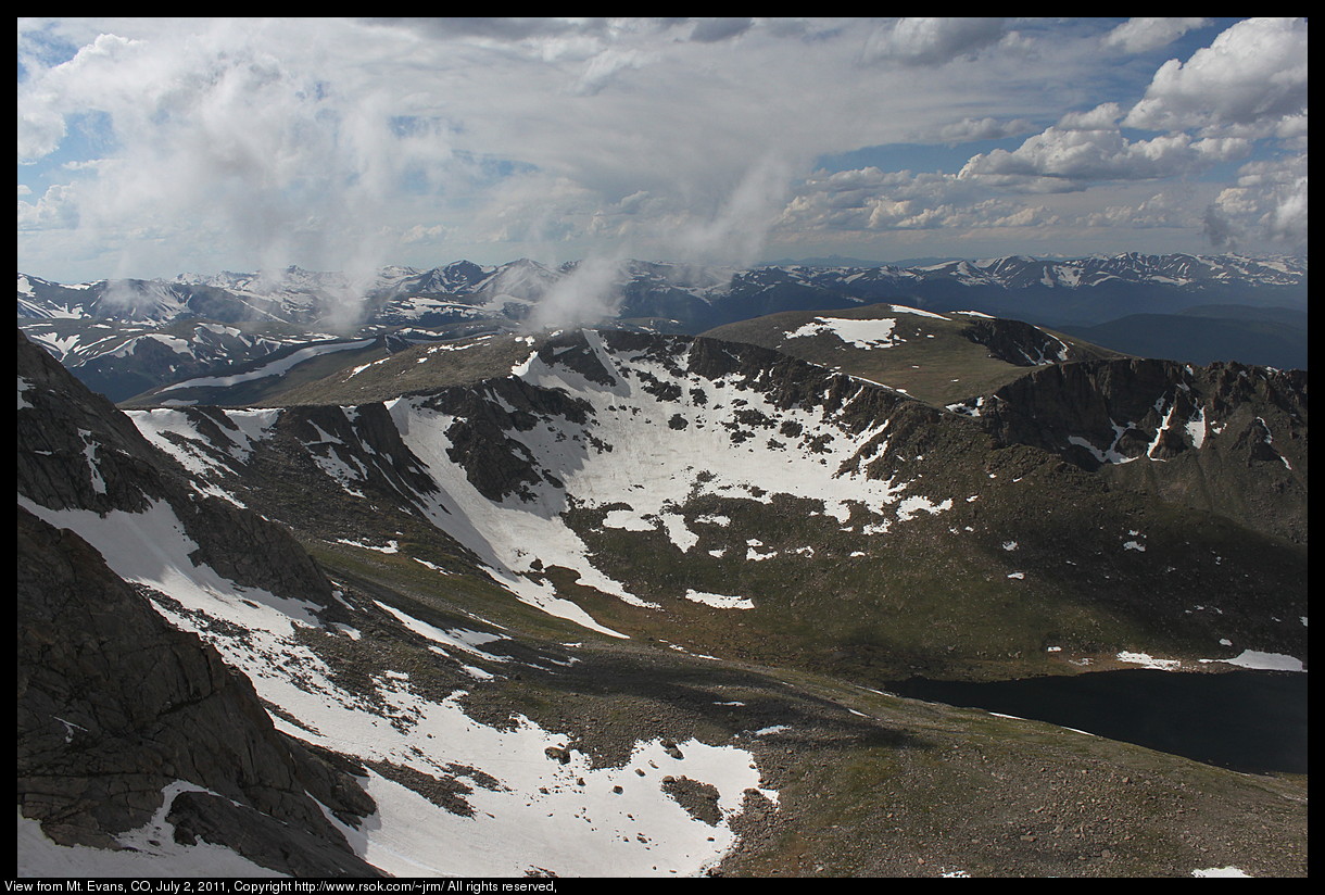 Mountain tops with snow seen from the top of the highest mountain.